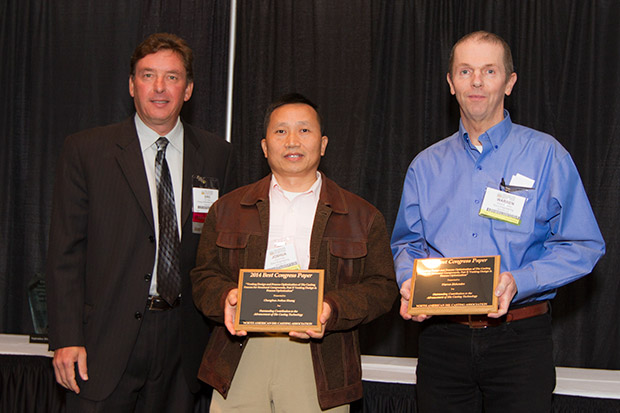 Members of the Exco team receiving the Best Paper award.